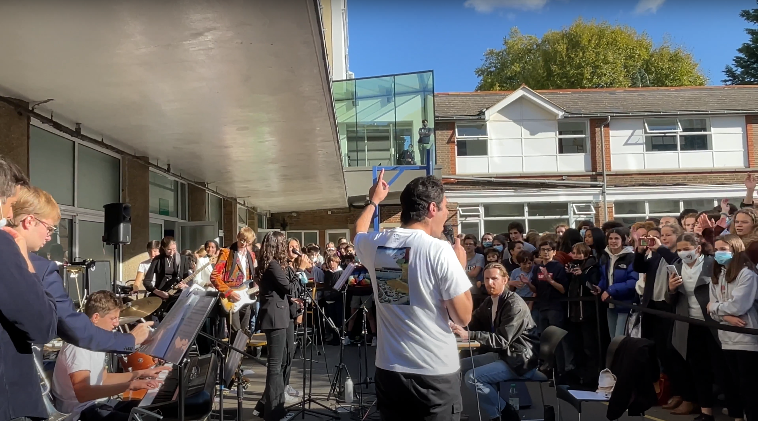 Emre in front of the large crowd